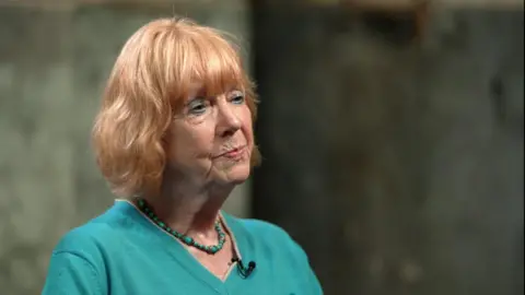 BBC Dame Vera Baird, a Caucasian woman wearing a green top and necklace, in an interview with BBC News in 2023