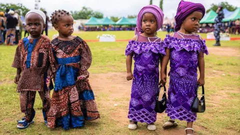 Olympia De Maismont/AFP Twins pose for a photograph during the Igboora World Twins Festival 2024, in Igbo-Ora - Saturday 12 October 2024.