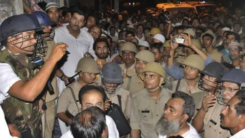 Getty Images Angry mob at Nagfani police station after an objectionable WhatsApp message sparked communal tension on July 5, 2015 in Moradabad, India. Tension had prevailed in the district after an 'objectionable' message against a community was allegedly circulated on a social networking app