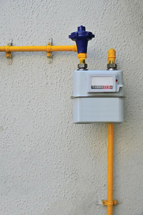 Getty Images PNG gas meter on house kitchen wall - stock photo