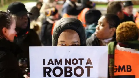 Reuters Striking workers outside Amazon's Coventry depot on 25 January 2023