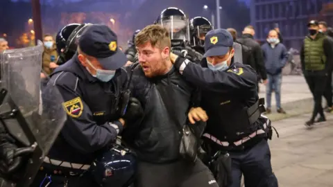 Getty Images Arrest during clashes in Ljubljana, 5 Nov 20
