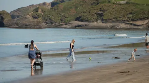BBC A group of people on a sunny beach