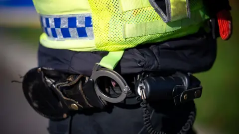 A stock photo of a police officer's handcuffs.