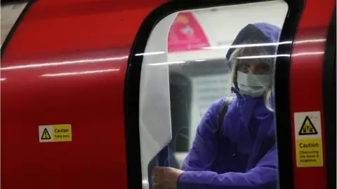 Reuters Woman wearing face mask