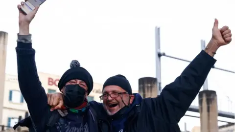 Reuters Supporters of the bill to legalise cannabis for personal use celebrate outside Parliament House after the bill was passed, in Valletta, Malta December 14, 2021