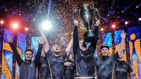 Getty Images Fnatic lift an esports trophy