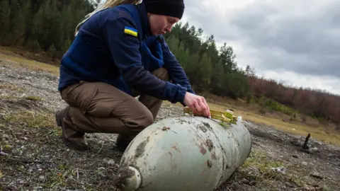 'MAT Kosovo/ FoU-EOD' Woman undertaking bomb disposal training