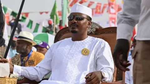 AFP An image of President of Chad Mahamat Déby sitting on a chair