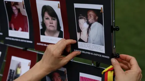 Reuters Images of victims of the contaminated blood scandal are displayed during a vigil to remember those that lost their lives, ahead of the release of final report of the Infected Blood Inquiry on Monday, in London, Britain, May 19, 2024.