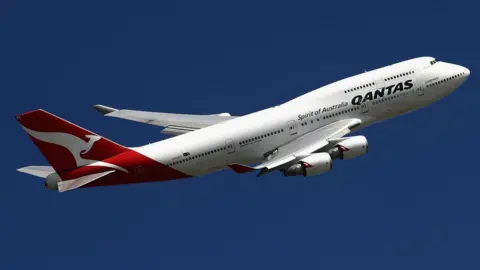 Getty Images A Qantas plane in the air