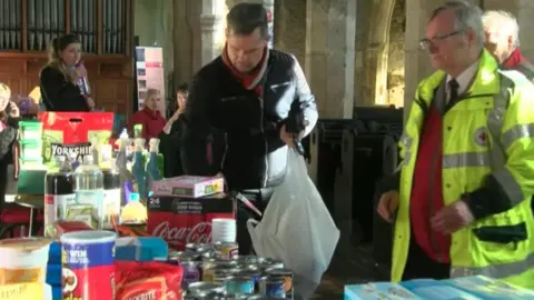 People at a food bank in a church