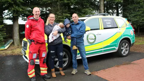 Dr Lyle Moncur, Naomi, Maisie, Max and Rich Clague with the rapid response vehicle