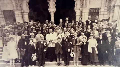 Liverpool Archdiocese Jack Traynor (centre) in a Liverpool Archdiocese Lourdes pilgrimage