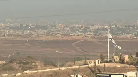 Reuters A view of the Gaza Strip from Israel, 10 August 