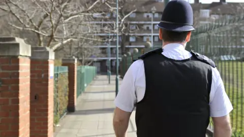 Metropolitan Police A Met Police officer from Hammersmith and Fulham walking his beat