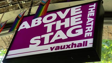 Above The Stag sign