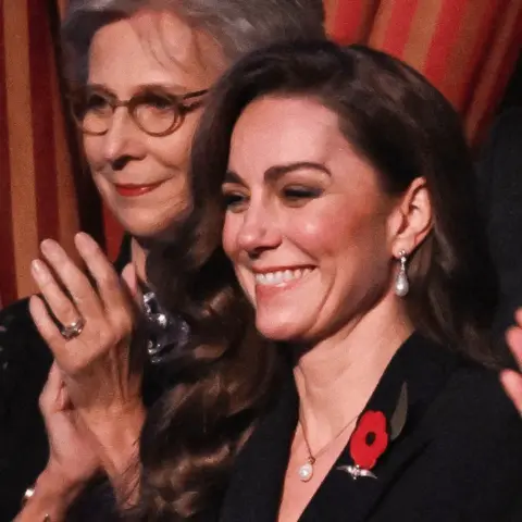 Reuters Catherine, Princess of Wales, smiles from the royal box at a Remembrance concert in London