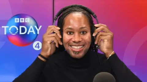 Jason Arday sits in a BBC Radio 4 studio wearing headphones beside a microphone during an appearance on the Today programme.