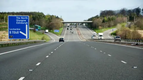 Lewis Clarke A view of the A74(M) motorway with junction 17 for Lockerbie on the left