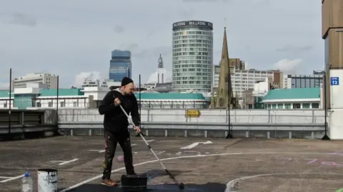 Birmingham City Council Joshua Billingham working on his mural