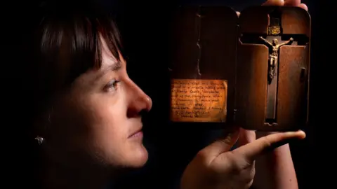 Bar Convent Woman holding up crucifix