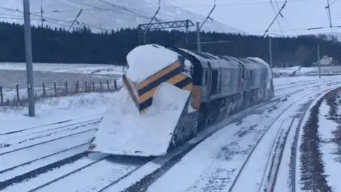 Network Rail Scotland Plough on train