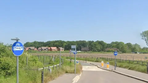 Google Development land off Hyde End Lane in Shinfield with new houses in the distance