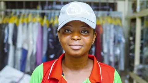 BBC Woman looking into the camera and smiling