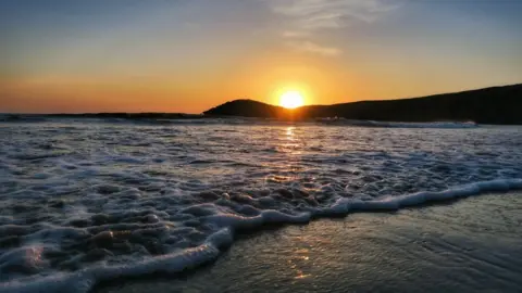 Huw Waldron Sunset over Whitesands Bay in St Davids