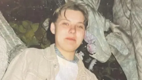 Image of Izabela who has short, fair hair and is wearing a beige jacket.