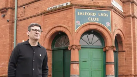 PA Media Andy Burnham outside Salford Lads Club