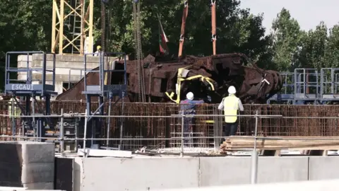 Staffordshire University Deborah being placed in the museum