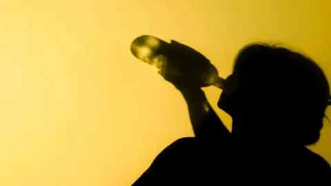 Getty Images Woman drinking - generic