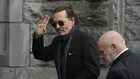 Niall Carson/PA Media Actor Johnny Depp arriving at the funeral in Nenagh
