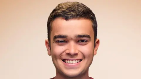 Opus Dei Pedro Ballester has brown curly hair