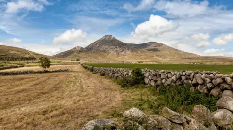Getty Images Mourne Mountains with blue sky.