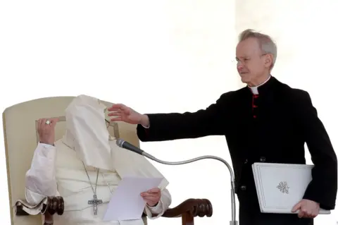 Max Rossi/REUTERS A gust of wind blows Pope Francis' mantle during the Wednesday general audience in Saint Peter's square at the Vatican, 16 May 2018.