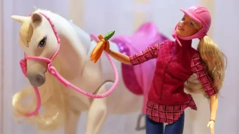 Getty Images Barbie and white horse