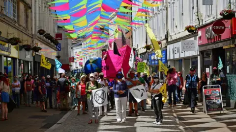 PA Media Protestors take part in an XR protest in Falmouth, during the G7 summit in Cornwall. Picture date: Saturday June 12, 2021.