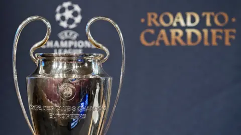 EPA The Champions League trophy