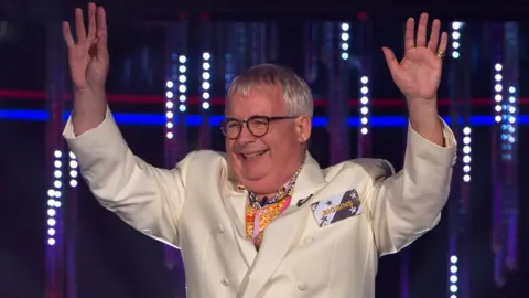 Getty Images Christopher Biggins is all smiles as he enters the house in July 2016