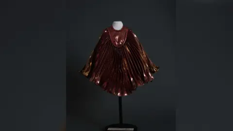 Salisbury Museum A miniature mannequin wearing a replica of a cape worn by Queen singer Fredd