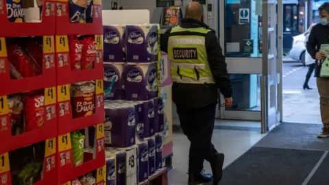 Getty Images A shop security guard