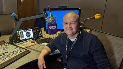 BBC Paul Miller in the BBC radio studio