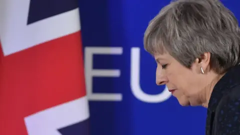 AFP British Prime Minister Theresa May walks away after holding a press conference in Brussels on March 22, 2019