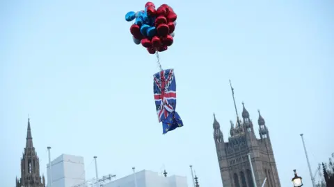 PA Brexit protesters release balloons in Parliament Square, Westminster, London, during The March to Leave protest