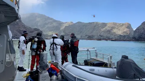 Reuters Members of a dive squad conduct a search during a recovery operation around White Island
