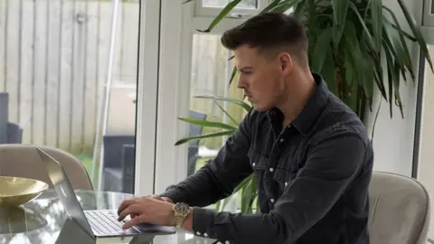 James Blake James Blake on a laptop