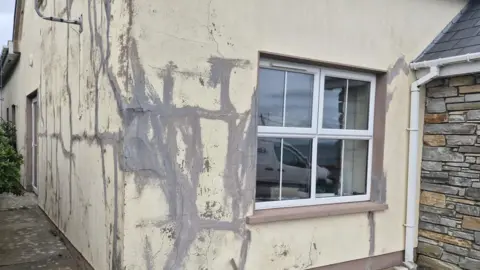 Ali Farren A house with large structural cracks 